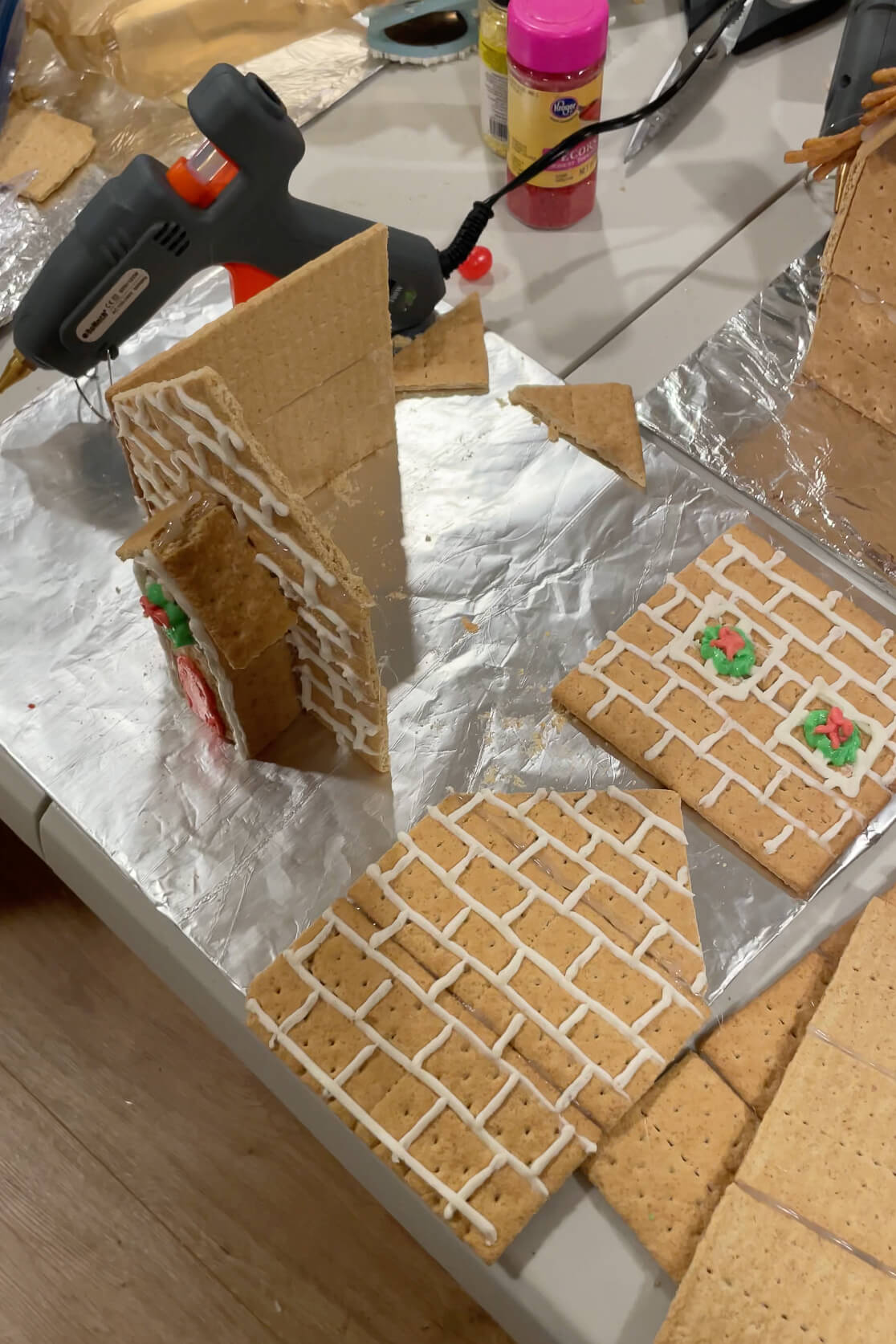 How to assemble a gingerbread house with a hot glue gun.